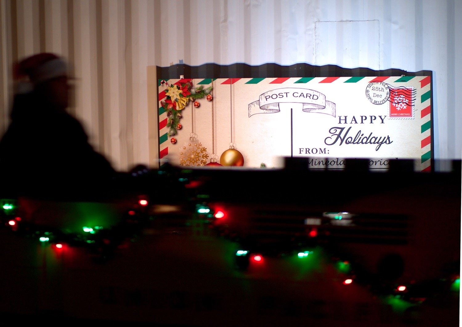 Mini-train conductor Eric Hooks brings the Meredith Special into the station. [see some more of Santa's stop]